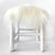 white fur stool cover