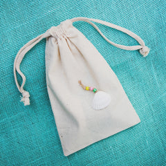 8 muslin bags with shell and beads charm