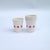 12 paper cups white with red stars