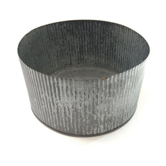 large wavy tin container